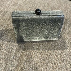 Classy evening purse, dark silver, 6’ long, 2’ wide, 4’ deep.
